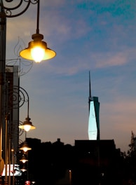 a street light with a building in the background