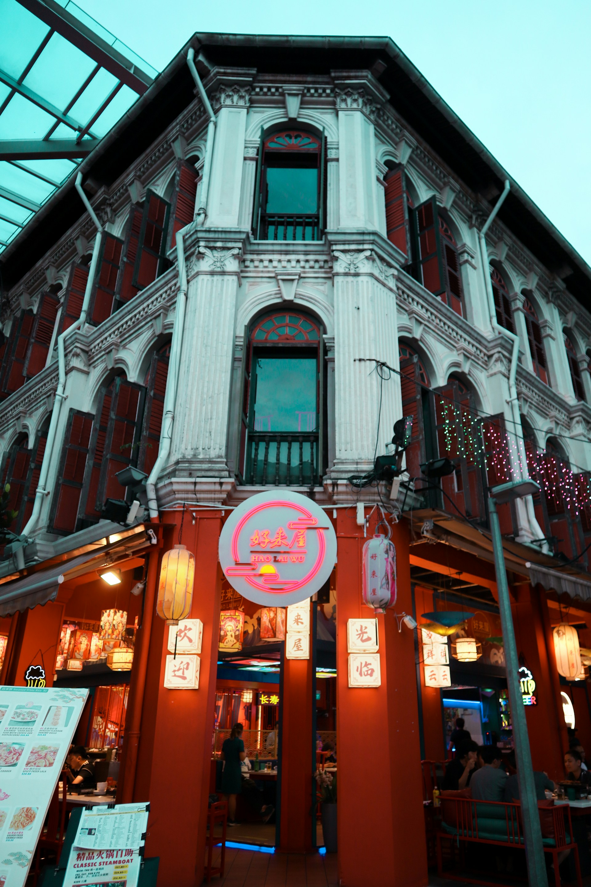 woman wearing yellow long-sleeved dress under white clouds and blue sky during daytime