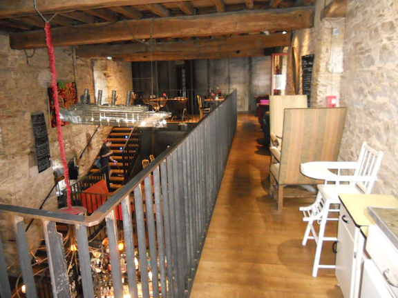 Cozy seafood dishes beautifully presented on rustic wooden table inside the restored mansion