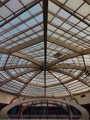 a glass roof in a building with a skylight