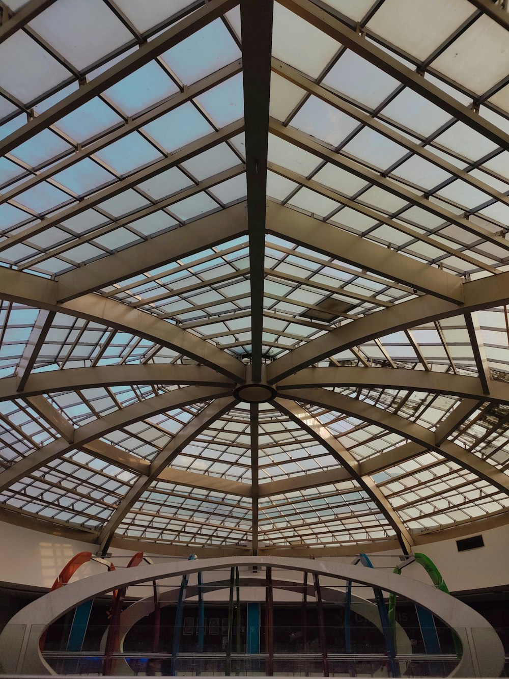 a glass roof in a building with a skylight