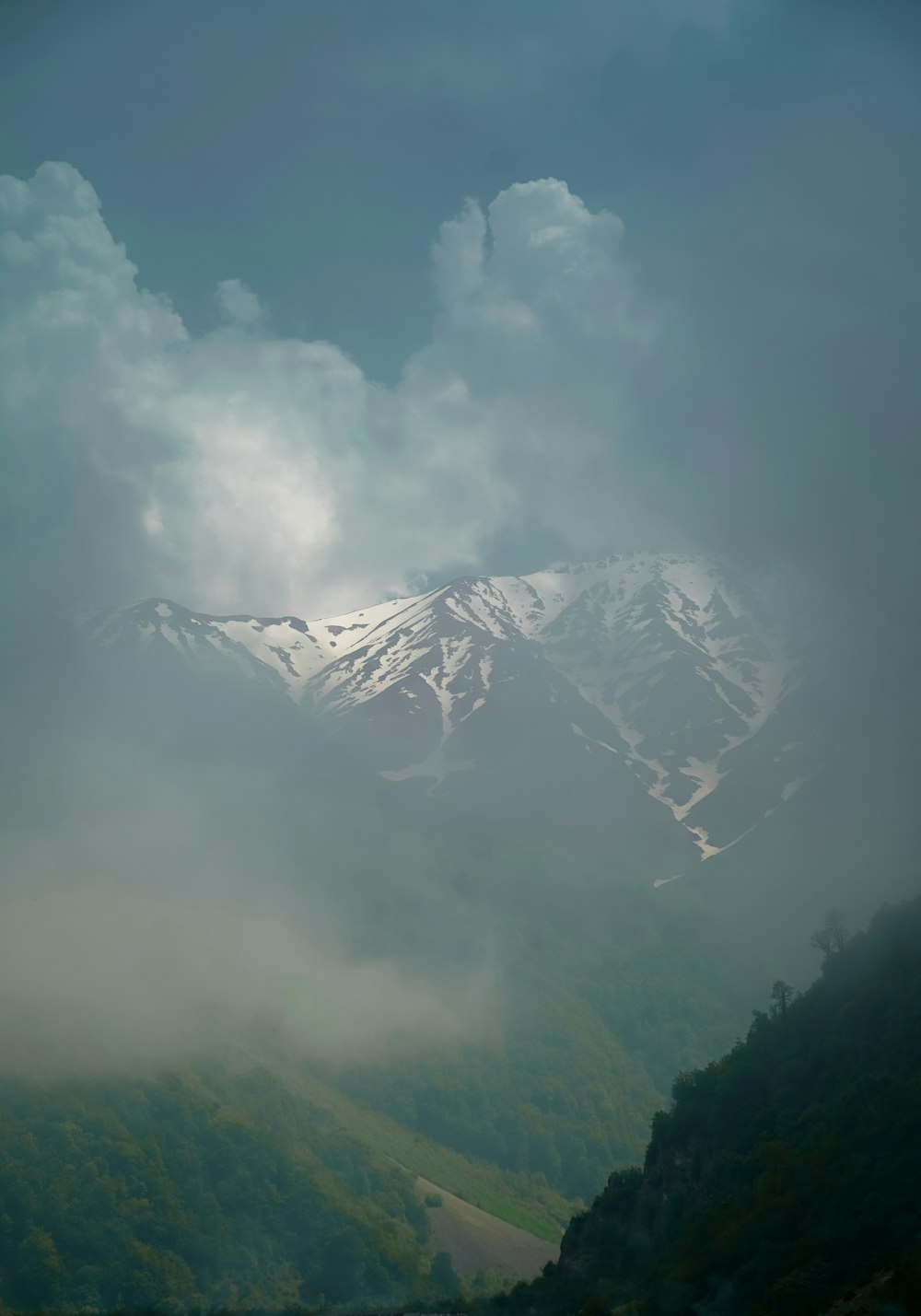 a view of a snowy mountain range from a distance