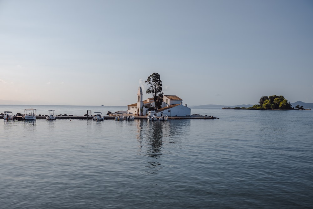 a house on a small island in the middle of the water