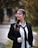 a woman wearing a black tie and a white shirt