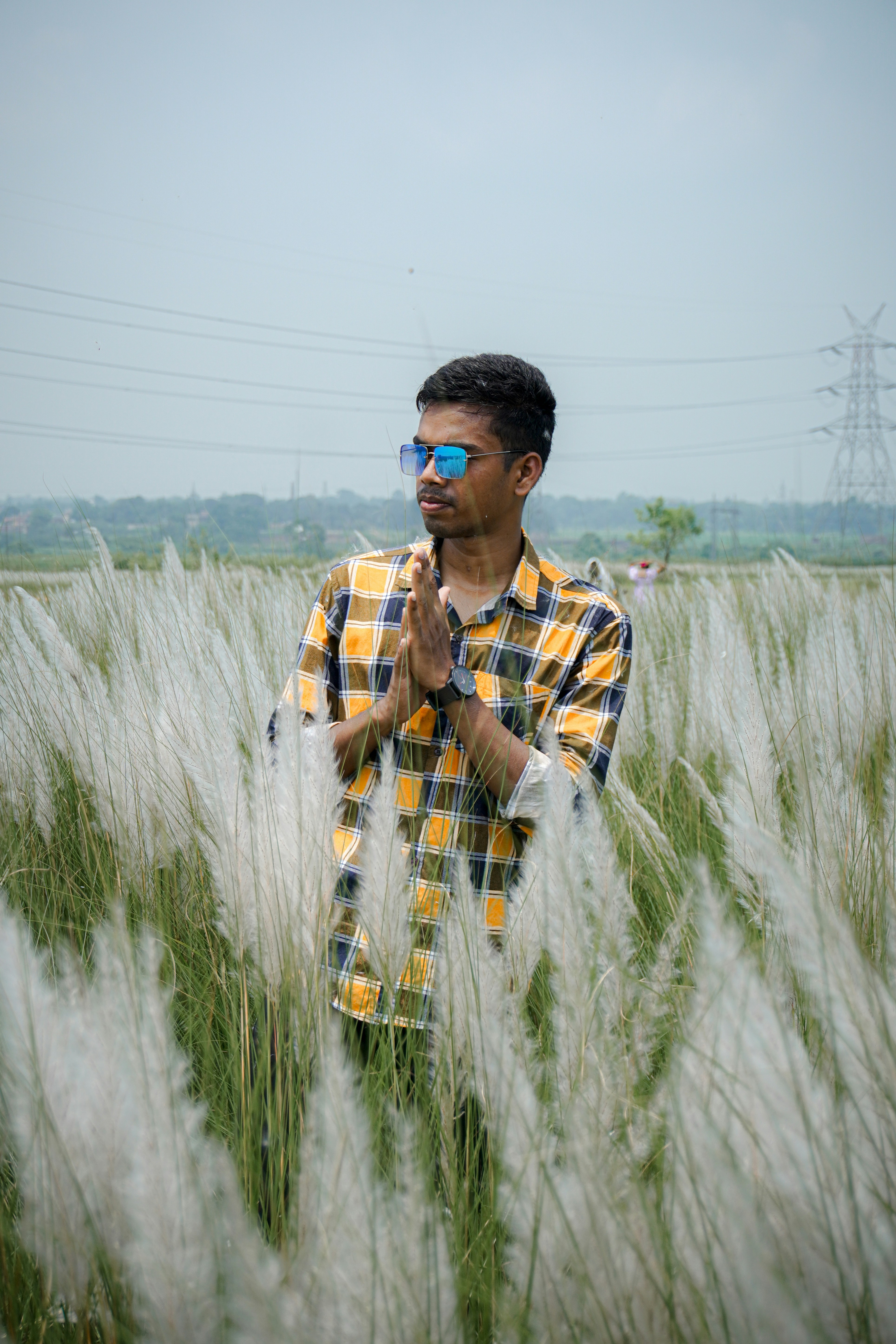 A man standing in a field of tall grass photo – Free Wallpaper Image on ...