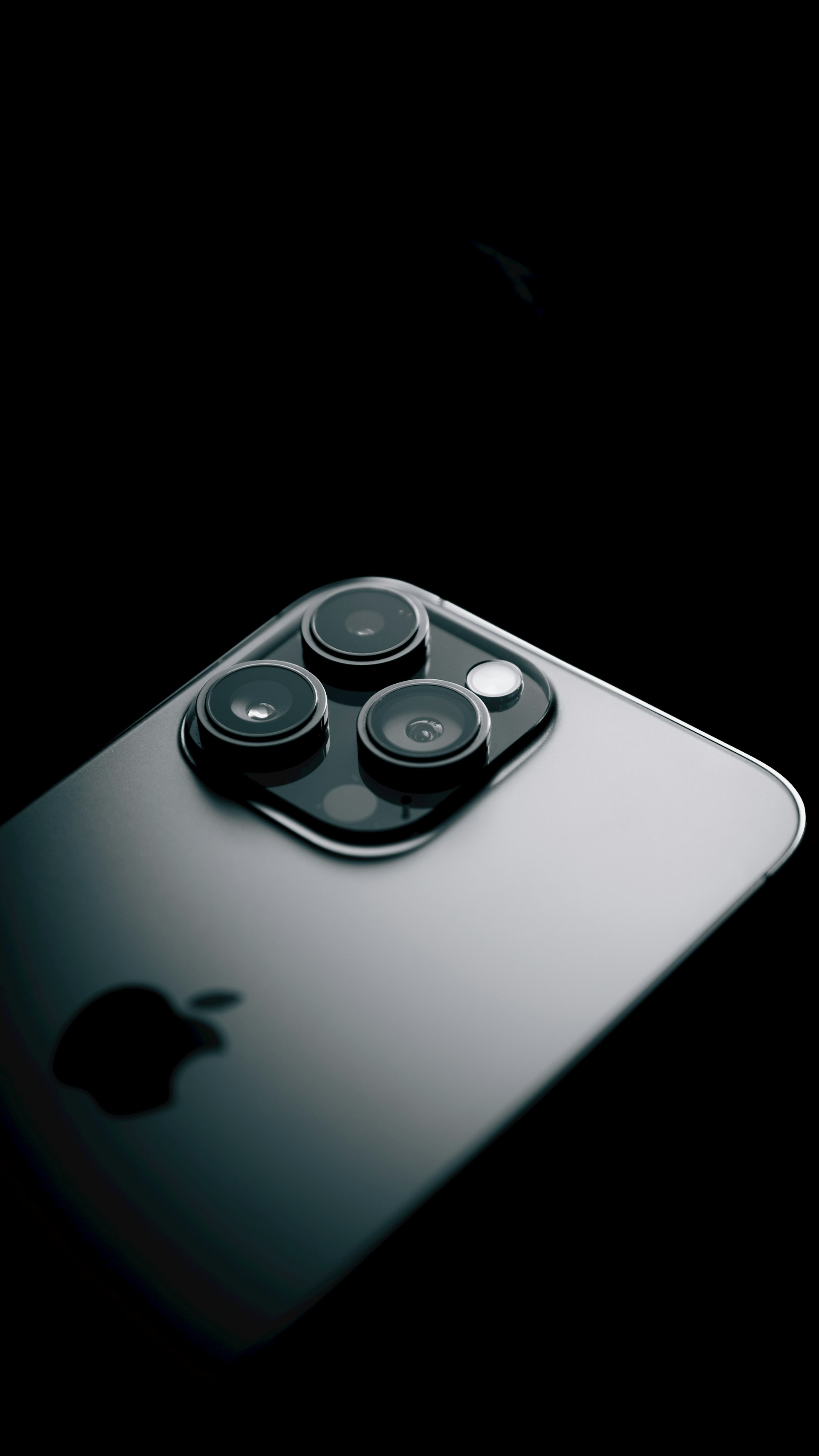 a close up of a cell phone with a black background