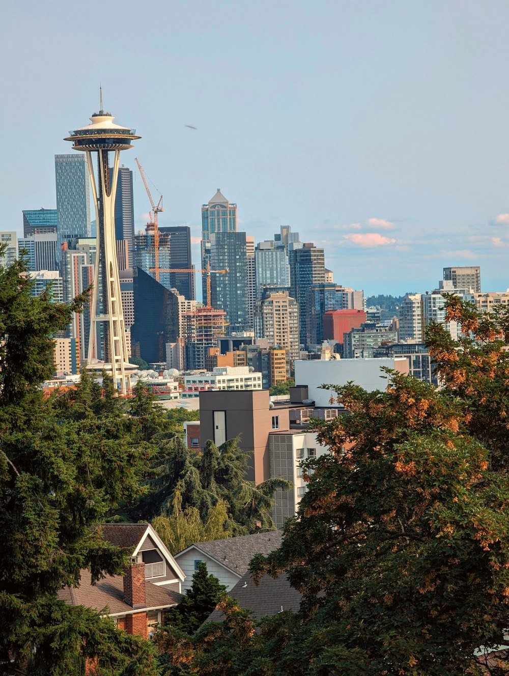 a view of the seattle skyline with the space needle in the foreground