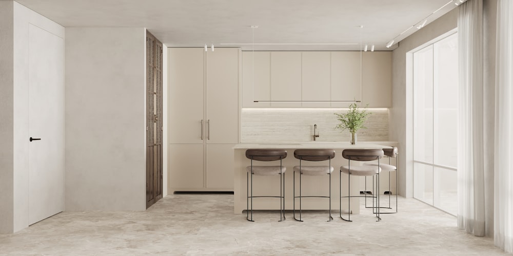 a kitchen with a table and four stools