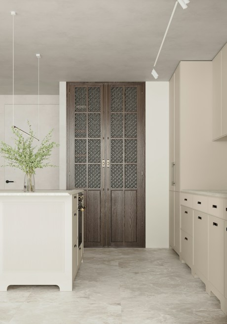 A modern kitchen with minimalist design features a central kitchen island and beige cabinets. The floor is made of light-colored tiles, and a vase with green foliage sits on the island. Natural light illuminates the room, enhancing the soft color palette. A set of large, dark wood paneled doors with intricate glass panes adds a focal point.