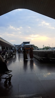 A vibrant image showing a happy traveler with luggage at an airport terminal.