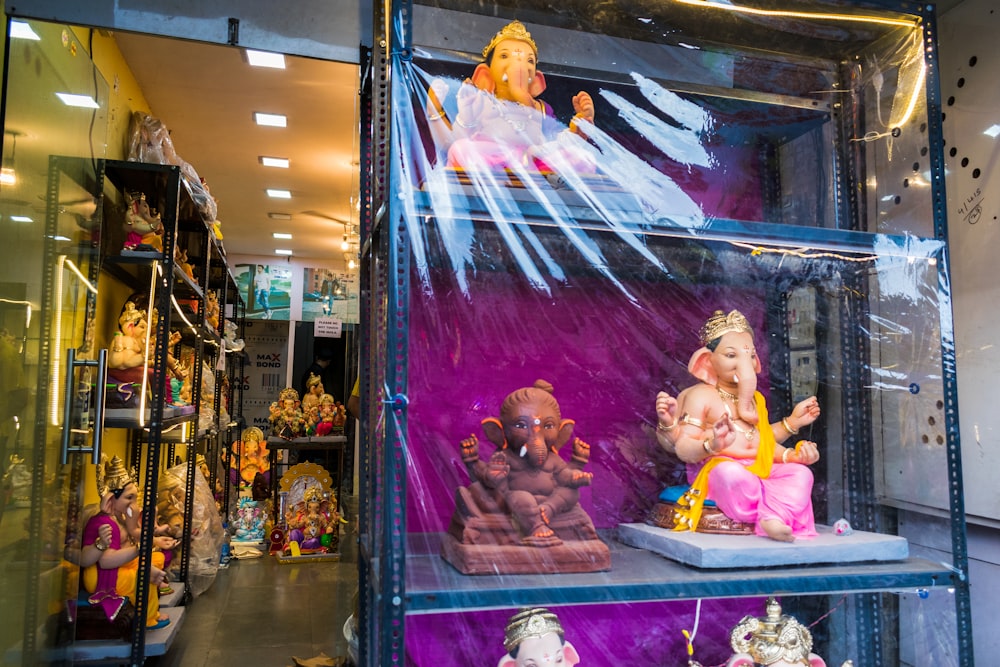 a display case filled with lots of small figurines