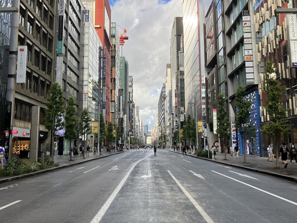 a person walking down the middle of a city street