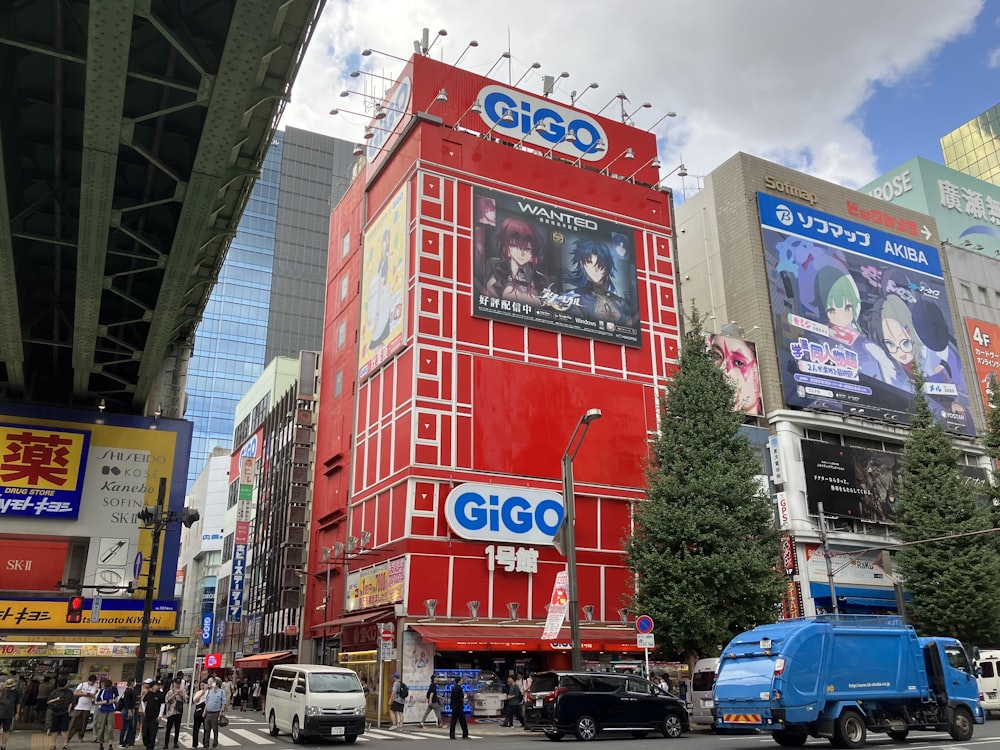 a large red building with a giant advertisement on it's side