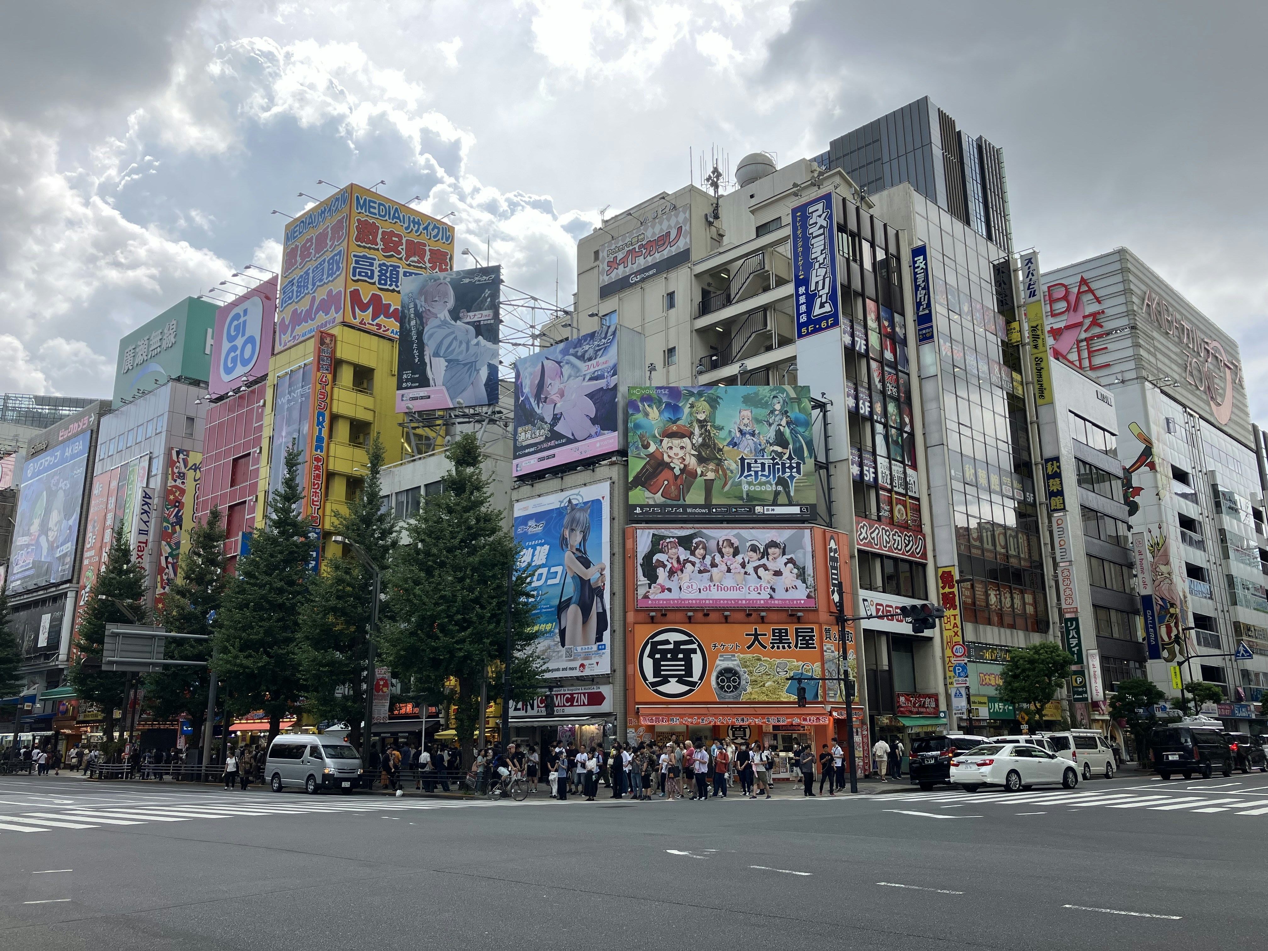 a city street filled with lots of tall buildings