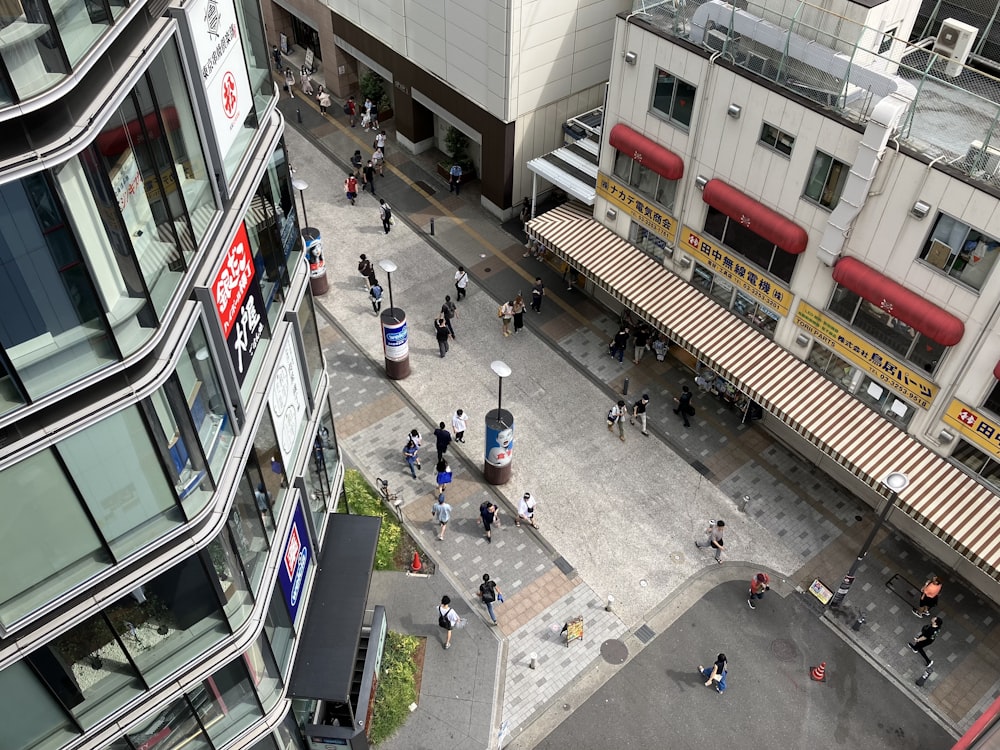 a group of people walking around a city street