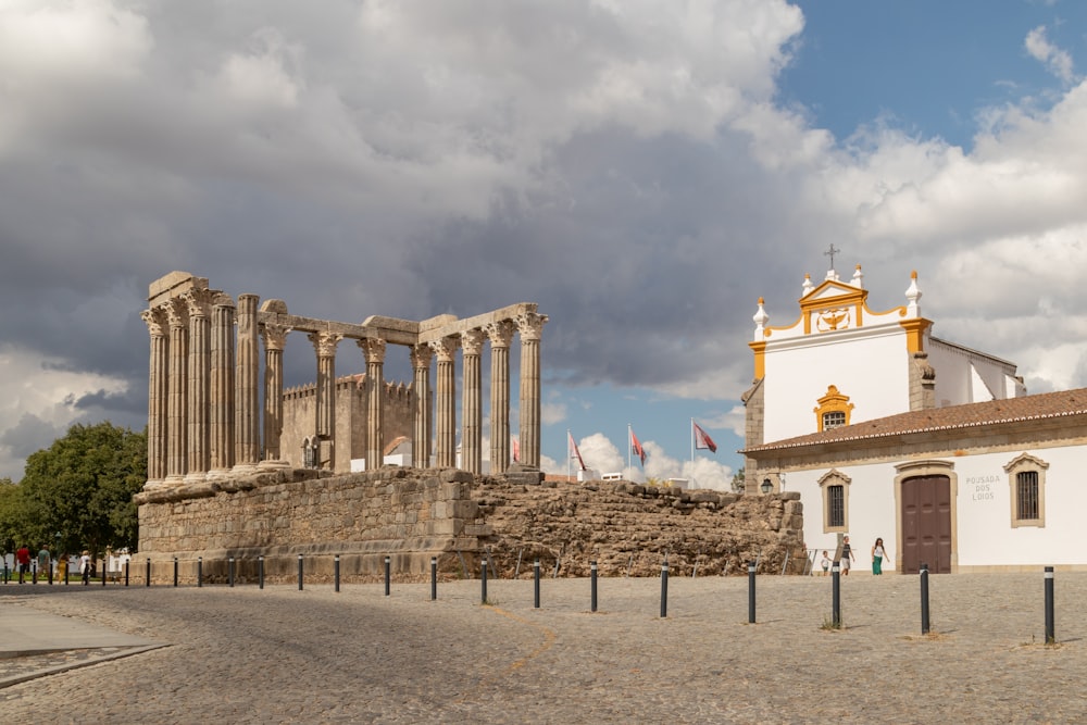 a large building with columns and a clock tower