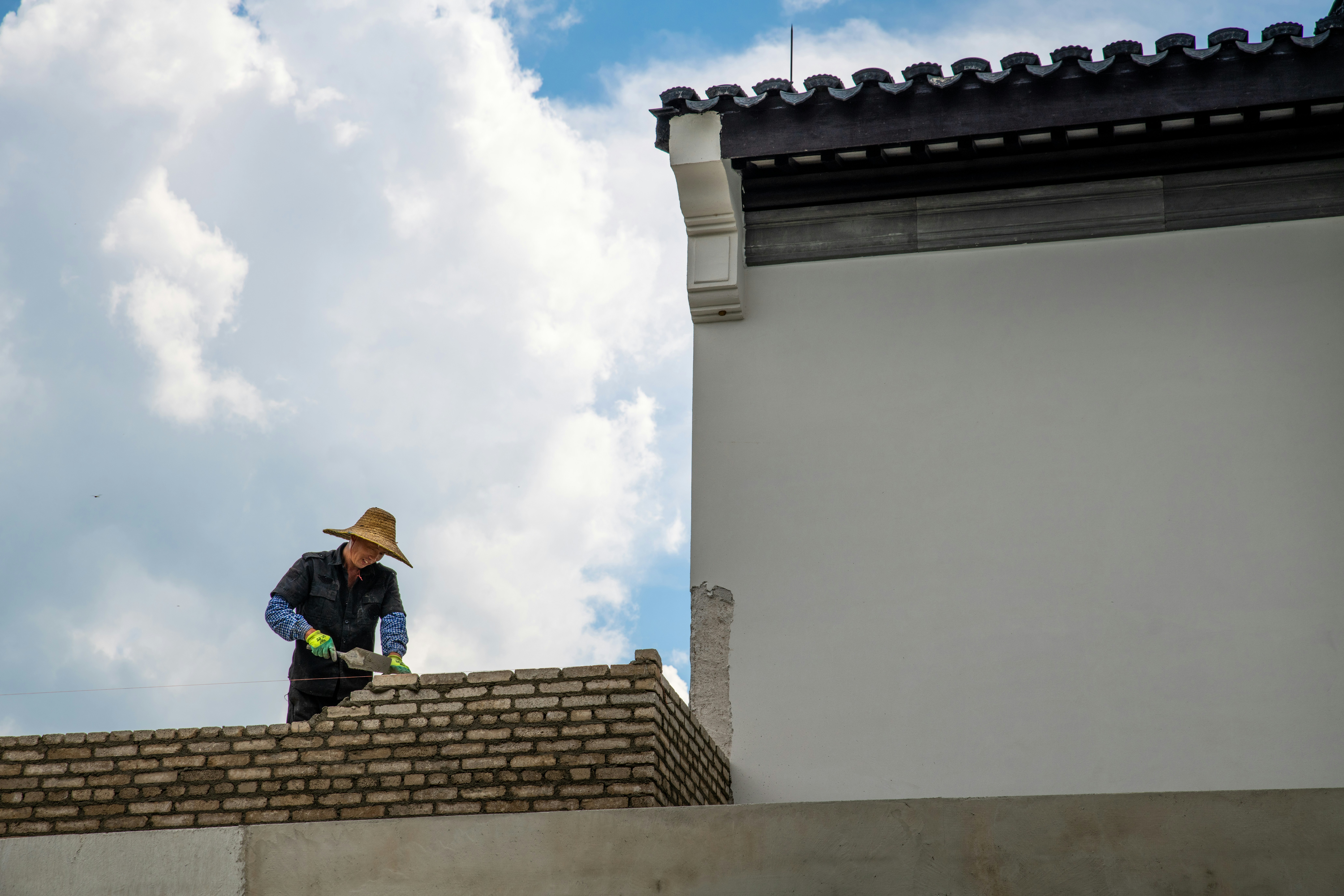 a man standing on top of a roof