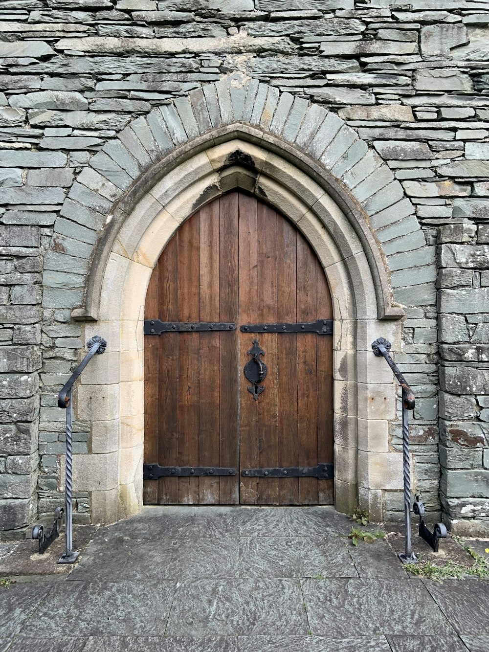 a stone building with a large wooden door