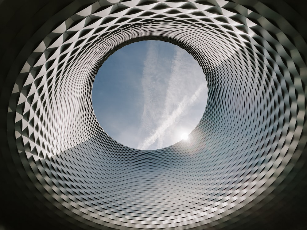 a view of the inside of a building with a sky in the background