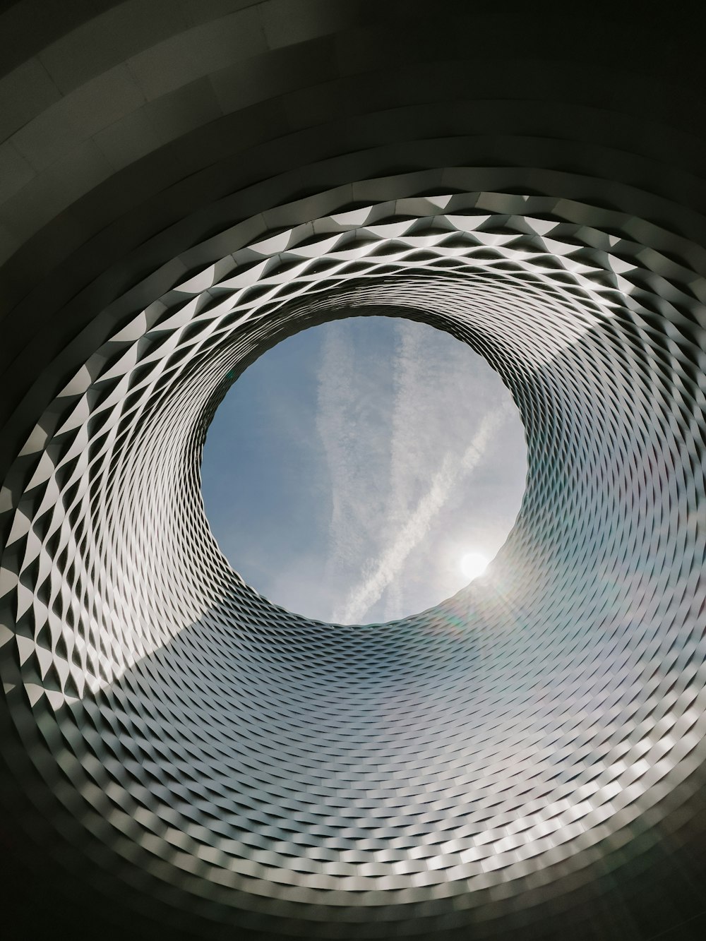 a view of the inside of a building with a sky in the background