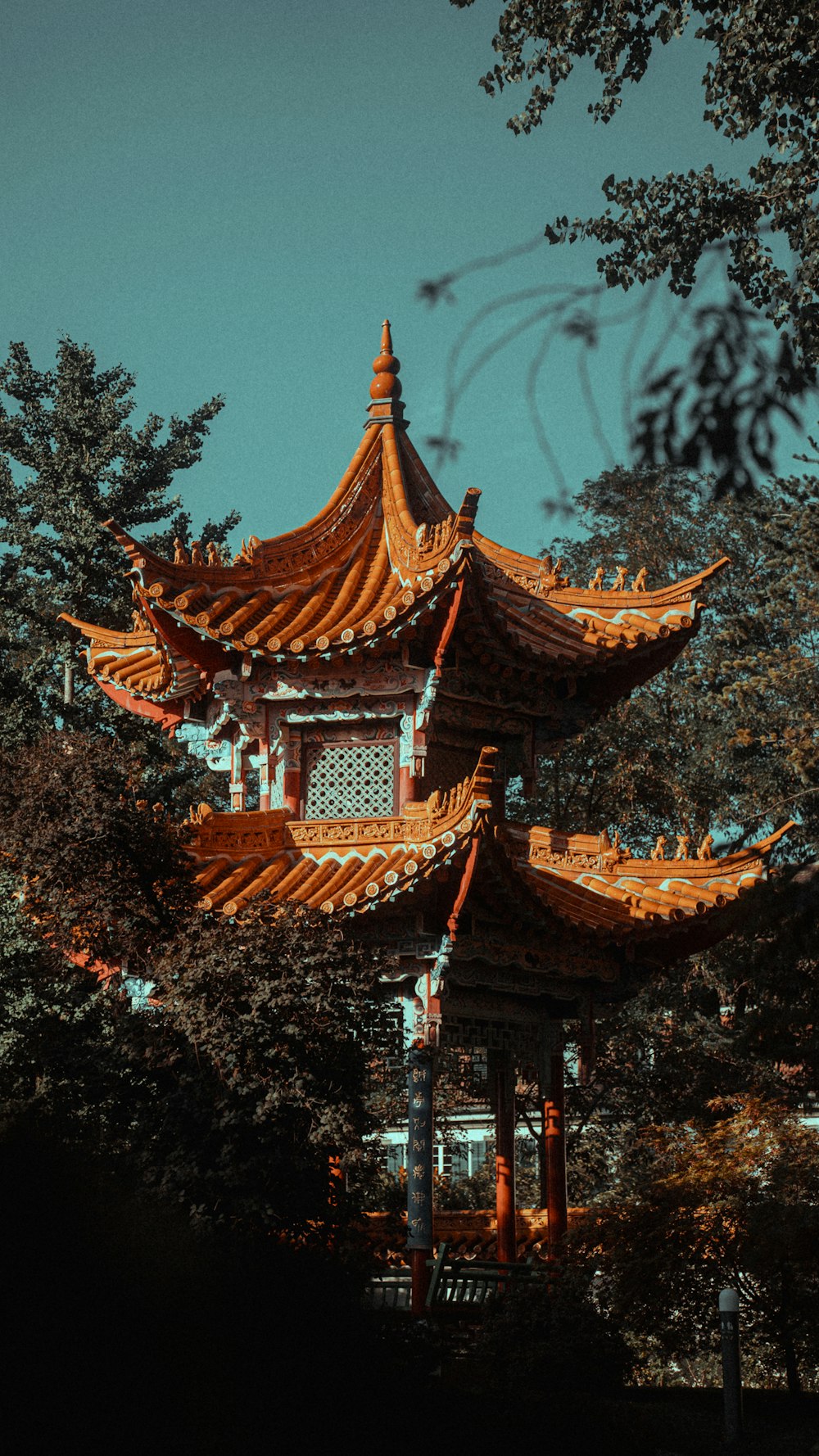 a tall building sitting in the middle of a forest