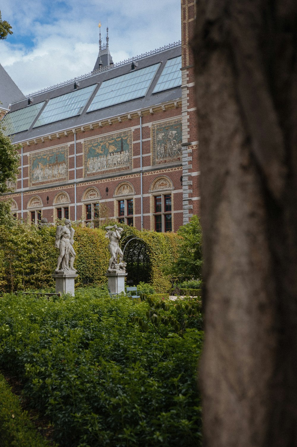 a large building with a statue in front of it