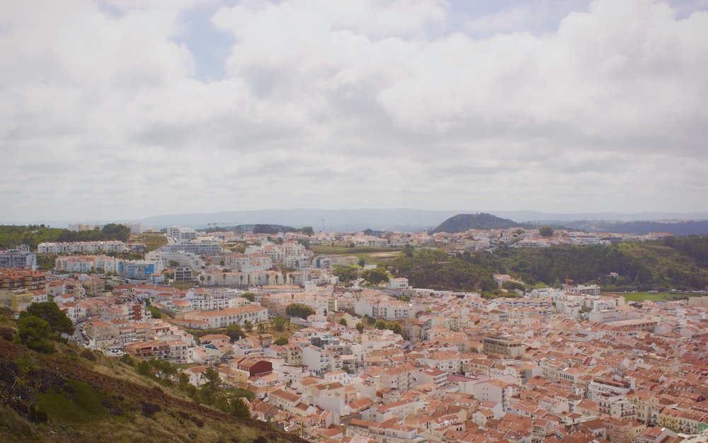 a view of a city from the top of a hill