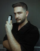 Close-up of a professional beard trim with precision tools.