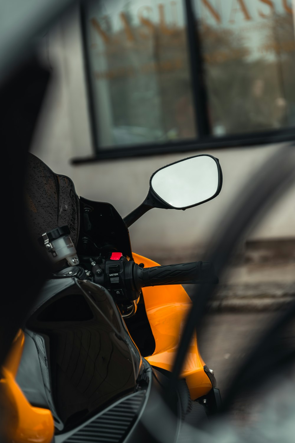 a close up of the side mirror of a motorcycle