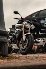 Close-up of a motorcycle securely fastened on a flatbed tow truck in Vienna.