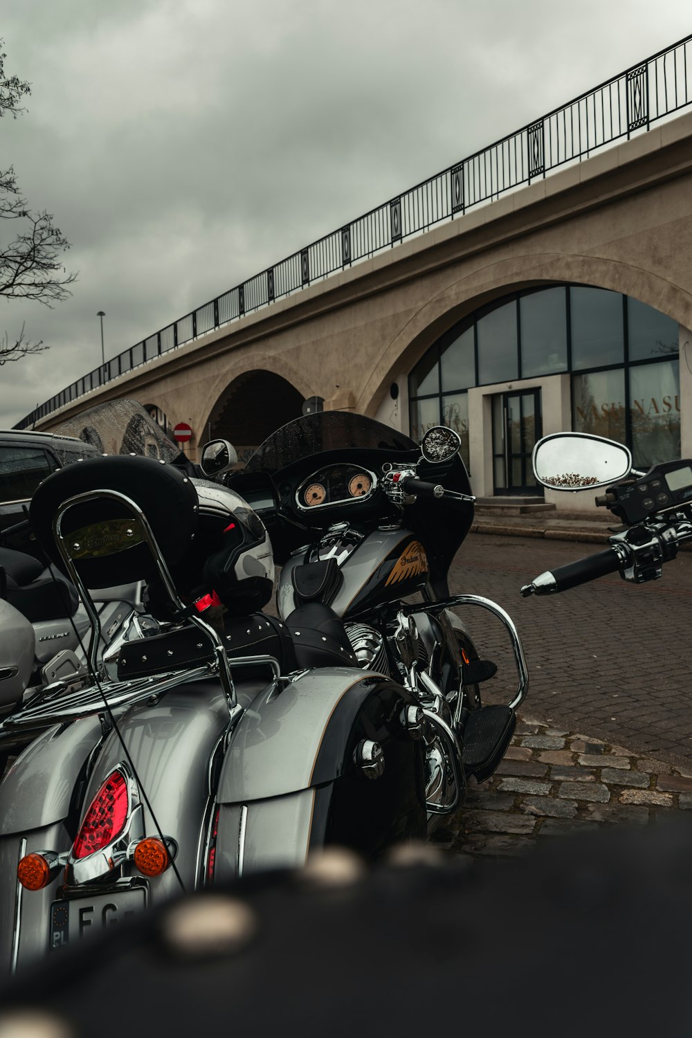 a group of motorcycles parked in front of a building