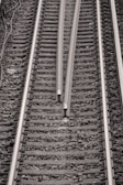 a black and white photo of a train track