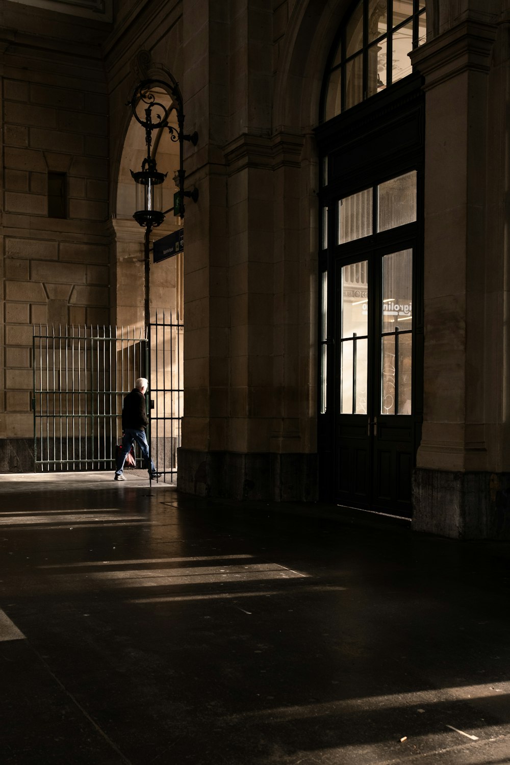 a person sitting on a bench in a building