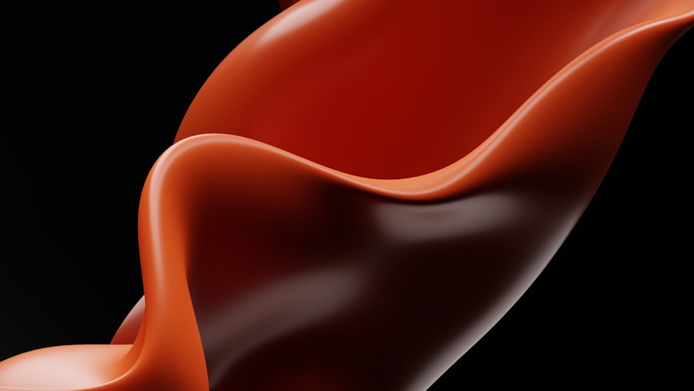 a red liquid swirl on a black background