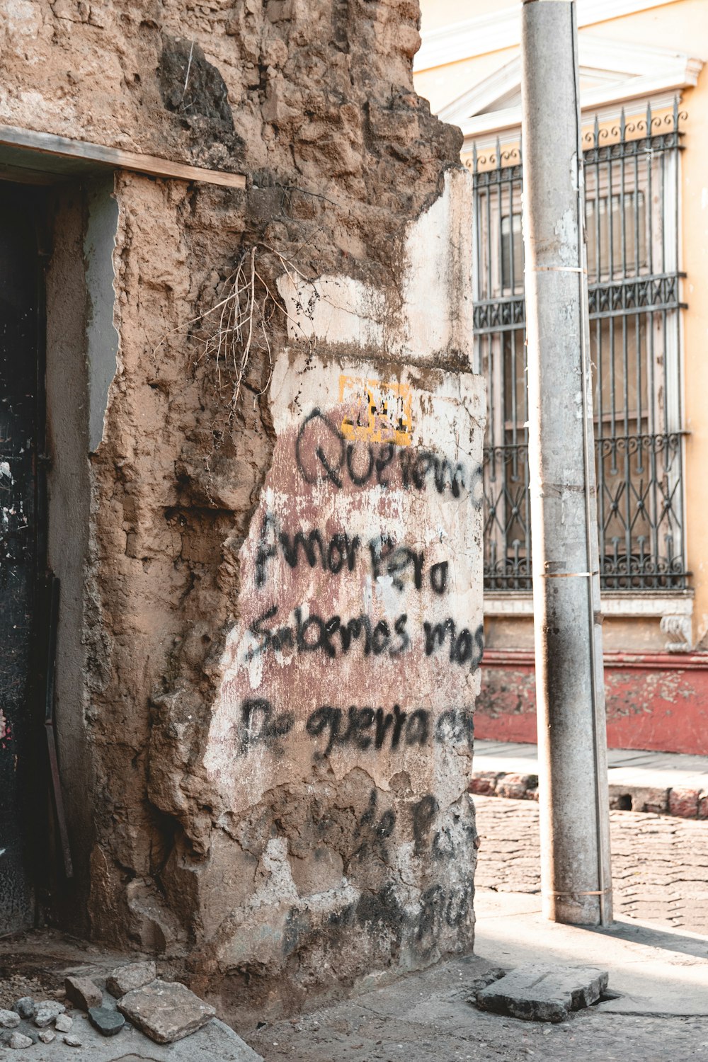 graffiti on the side of a stone building