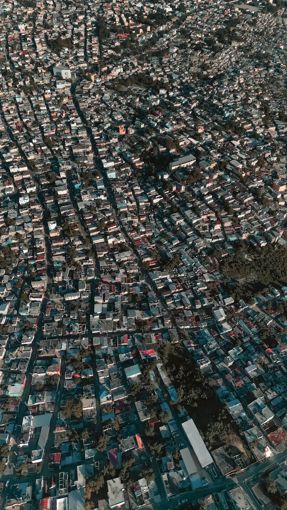 an aerial view of a city with lots of houses