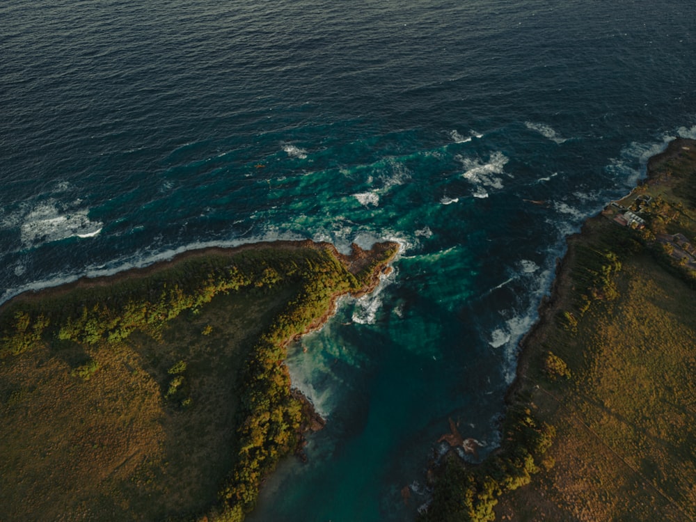 an aerial view of a body of water surrounded by land