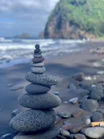 a stack of rocks sitting on top of a beach
