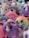 A colorful assortment of plush soft toys arranged neatly.