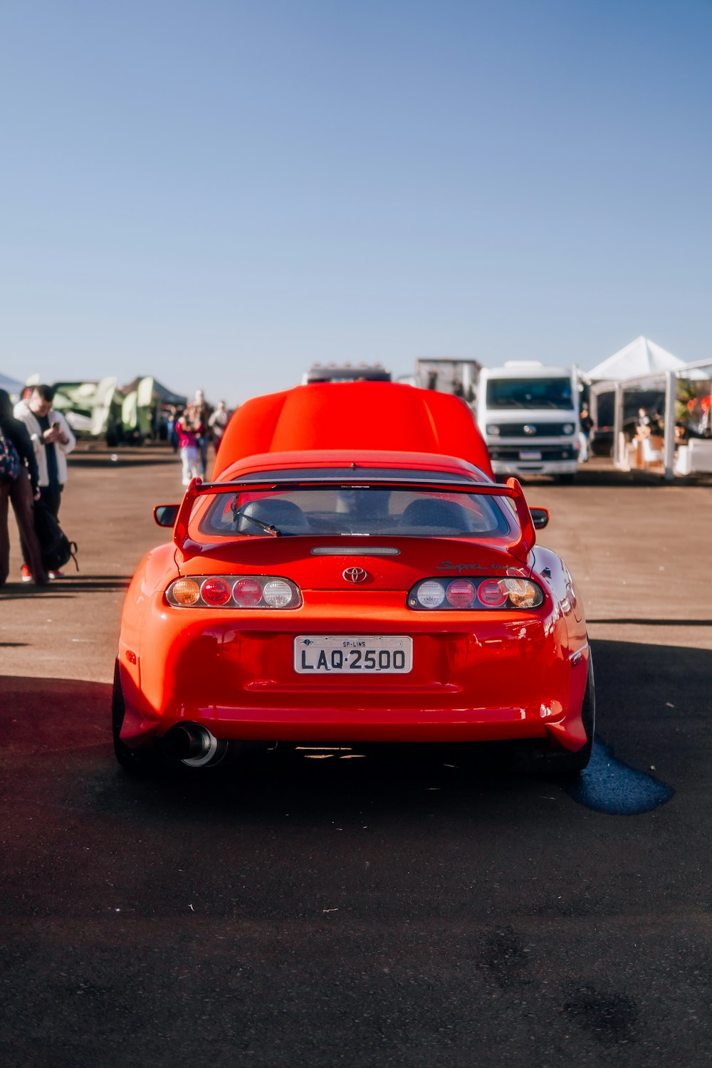 a red car parked in a parking lot