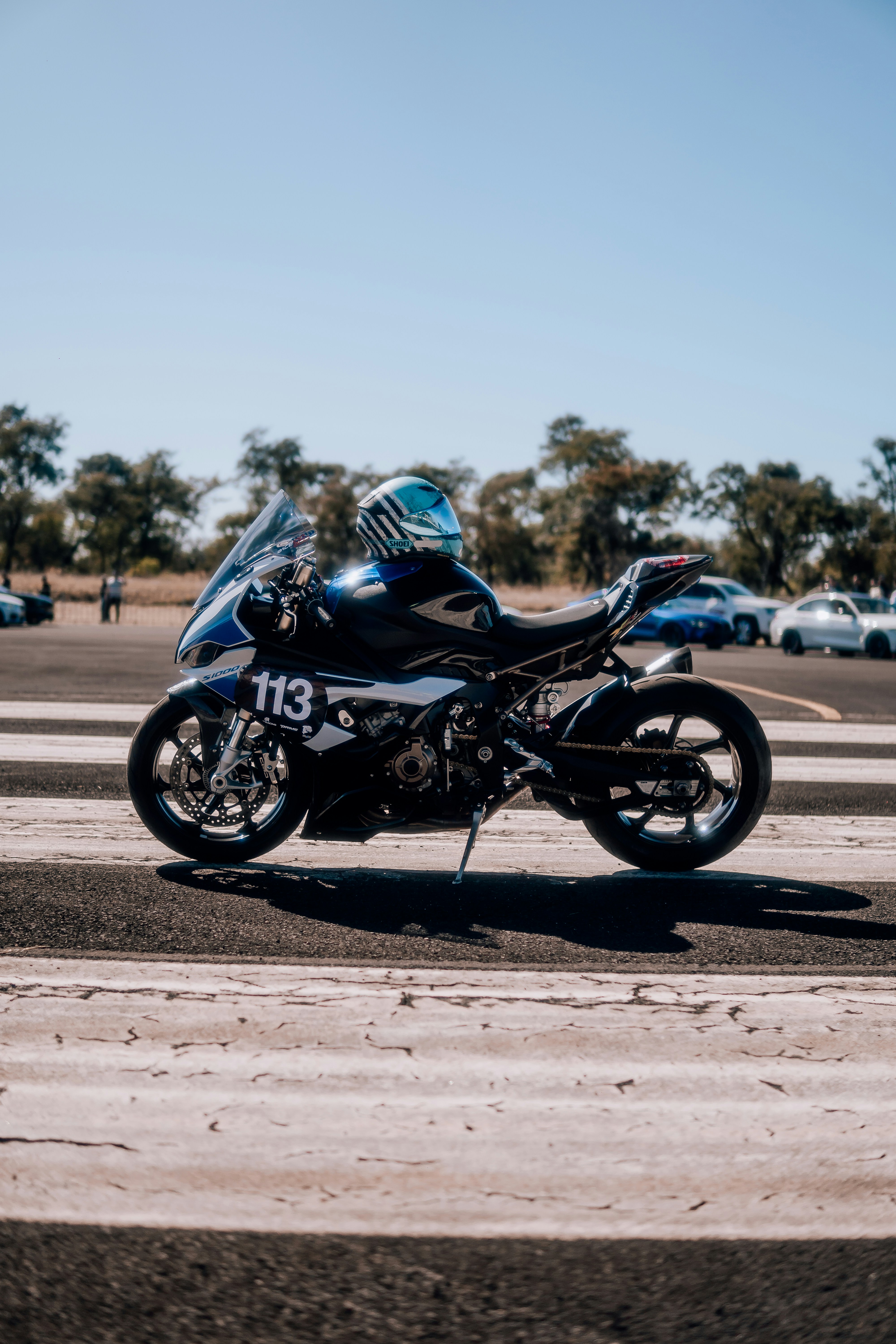 woman wearing yellow long-sleeved dress under white clouds and blue sky during daytime