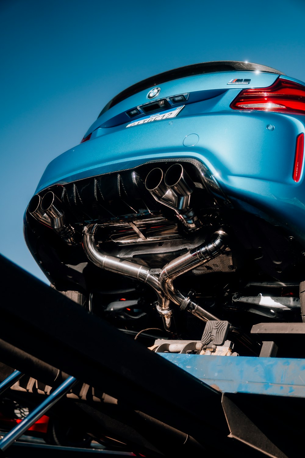 the back end of a blue sports car