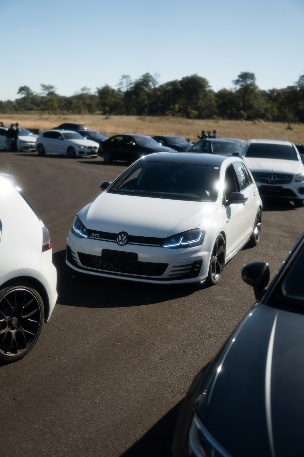 a group of cars parked in a parking lot