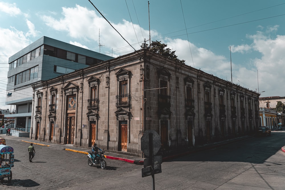 a large building sitting on the side of a road