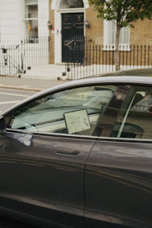 A car with a location pin hovering above it, illustrating precise tracking.