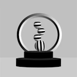 Minimalist composition showing the xcalion racket resting on a smooth antracite surface with white accents.