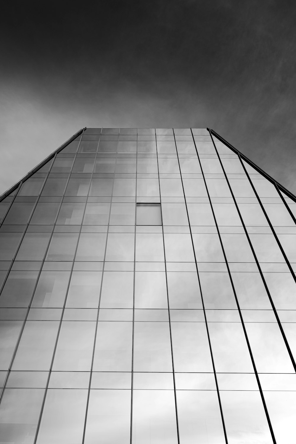 a black and white photo of a tall building