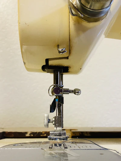 Detailed image of sewing machine parts laid out on a clean surface, highlighting quality and precision.