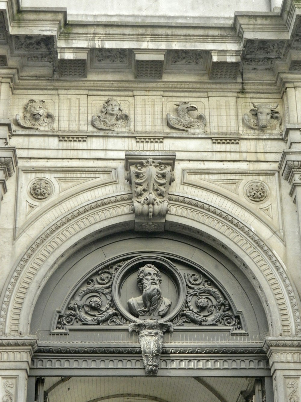 a large stone building with a clock on it's side