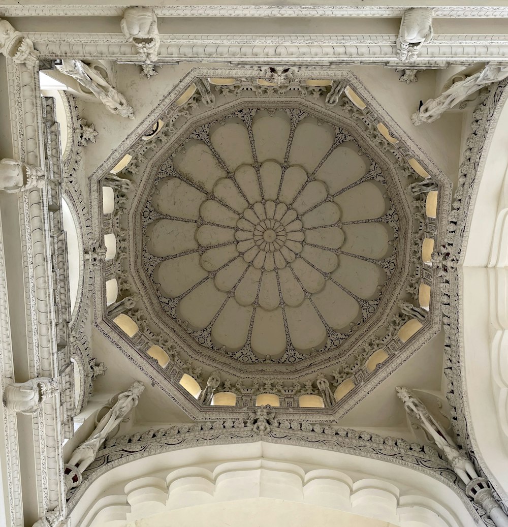 the ceiling of a building with a circular design